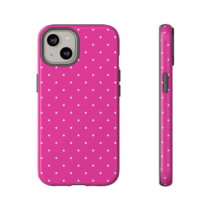 Fuchsia pink polka dot iPhone case for women, featuring durable polycarbonate back and shock-absorbing bumper for stylish protection.